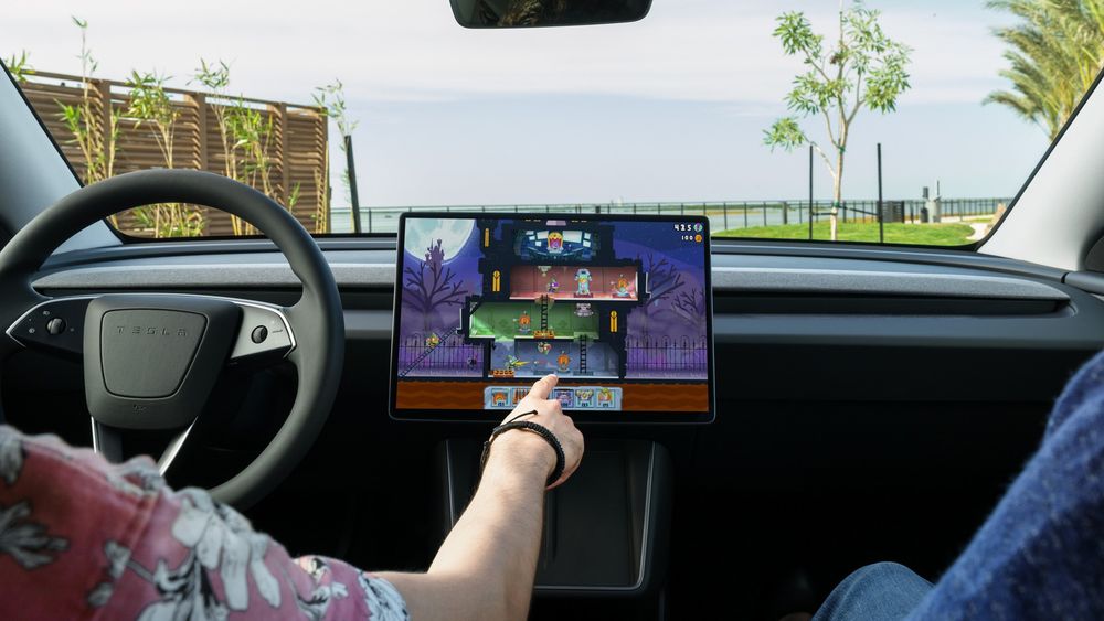 Described as a way to gain and retain customers, Tesla is looking at adding Apple CarPlay functionality just as GM is removing it from its own vehicles.